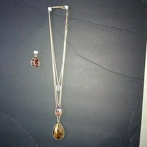 Gold 3 layered necklace with stones and earrings.
